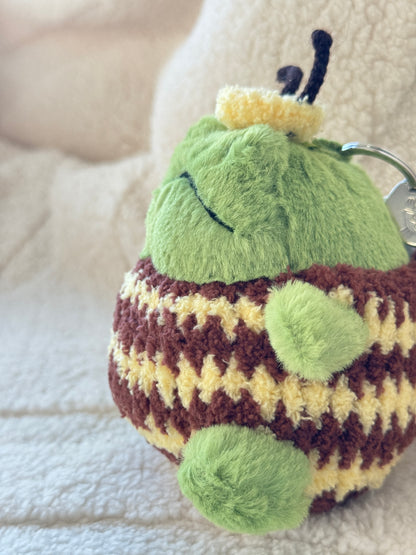 Back view of handmade bumble bee costume for Jellycat Ricky Rain Frog showing crochet bee wings and striped body detail.
